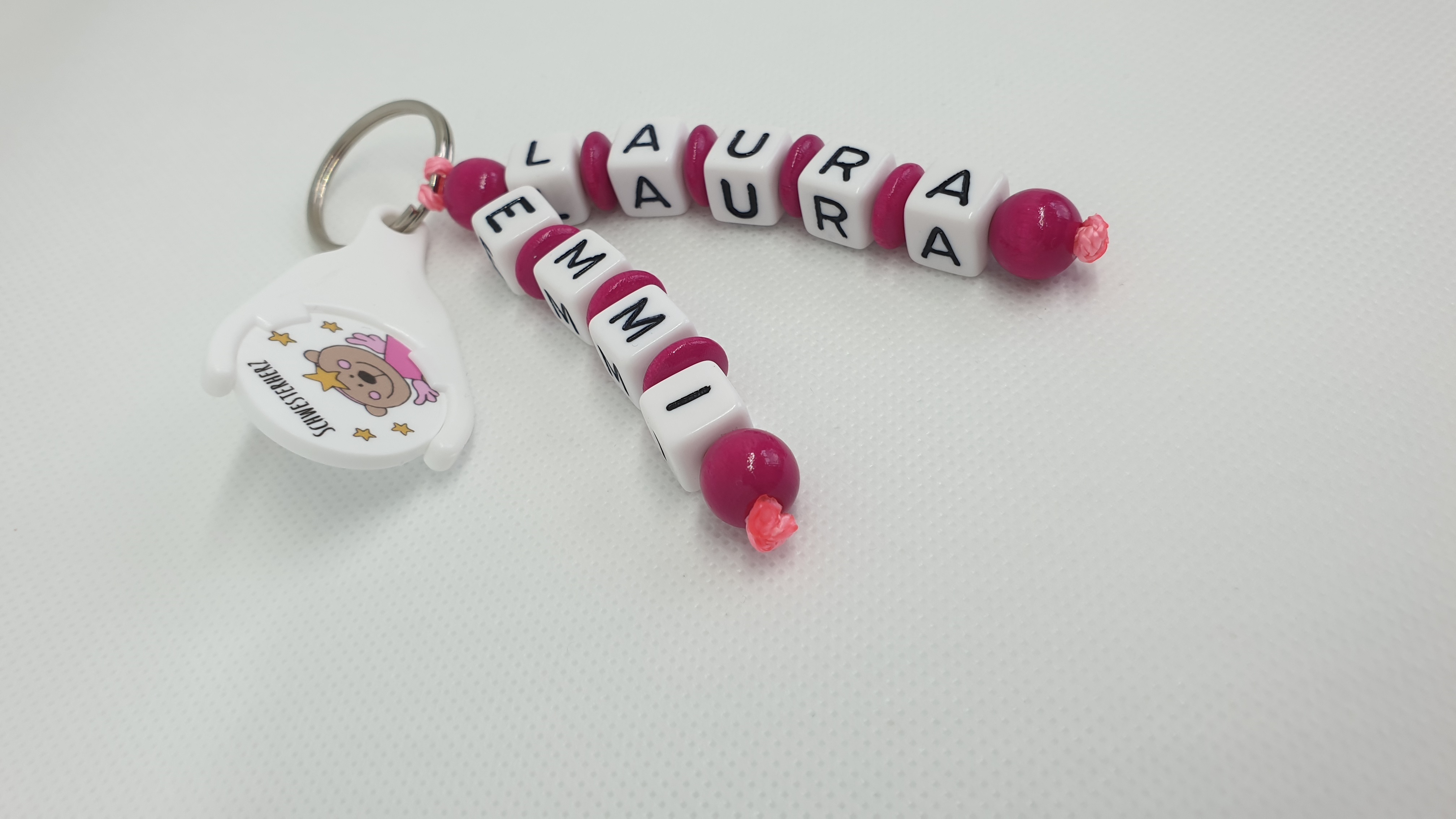 Schlüsselanhänger mit Namen - Schwesterherz in pink